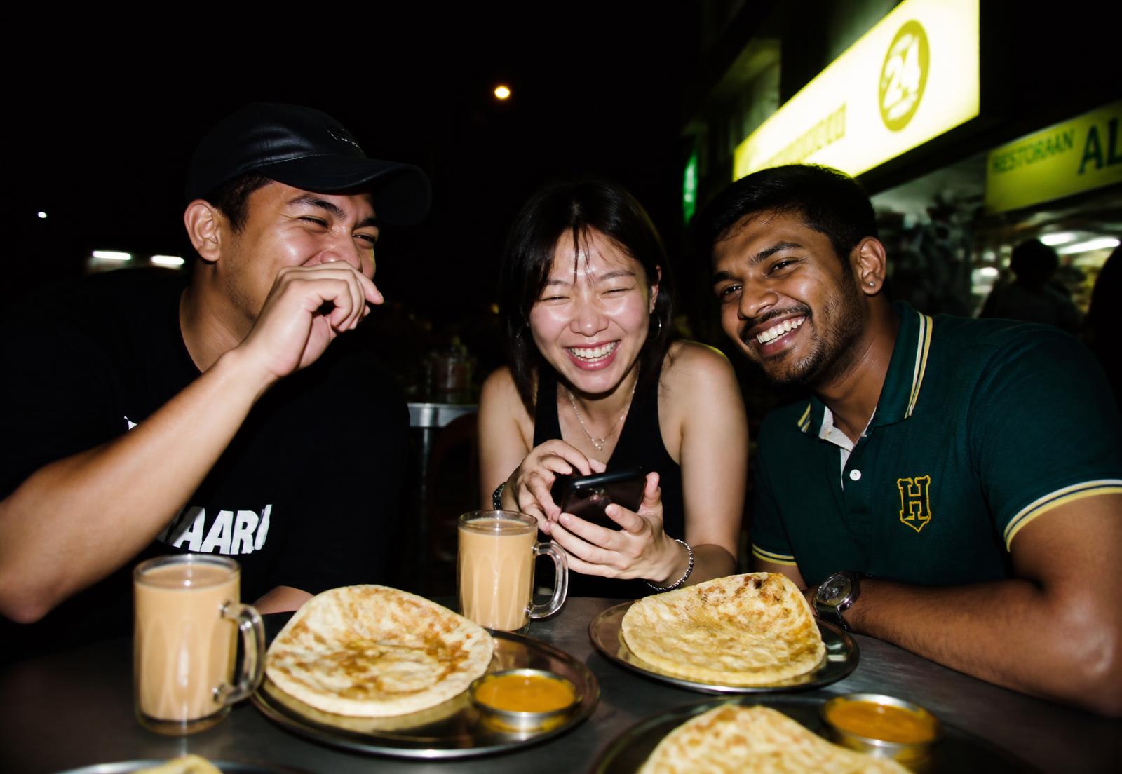 Local Malaysian food merchant presenting nasi lemak and fried chicken